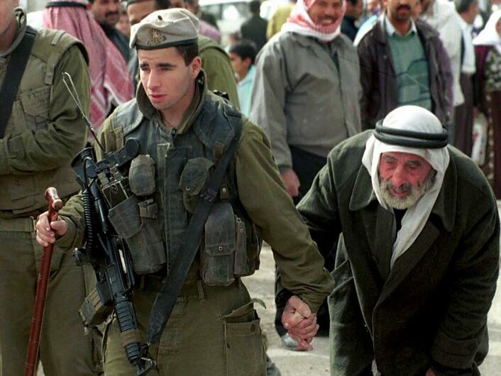 IDF soldier helping Arab man ICEJ 2023 Apartheid Response