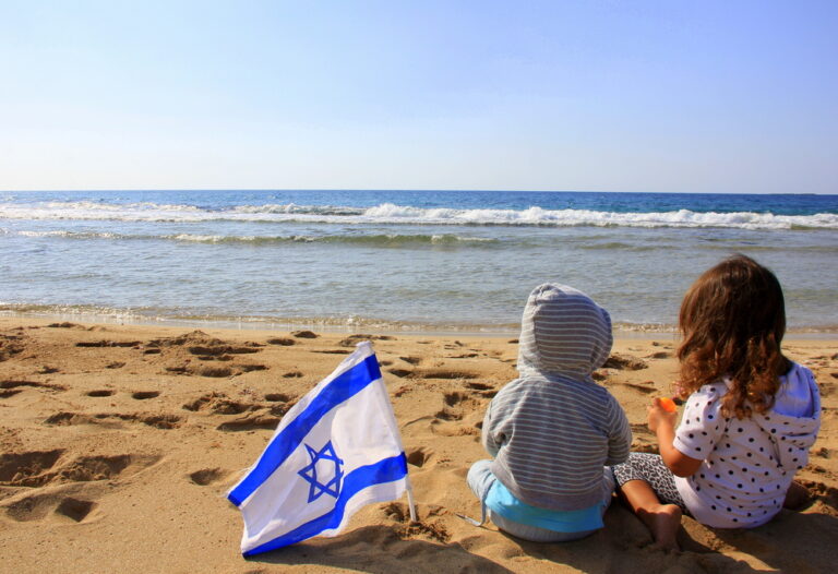 Children On The Beach With The Flag Of Israel ICEJ Shema Directors Updates Sarah Way 2023