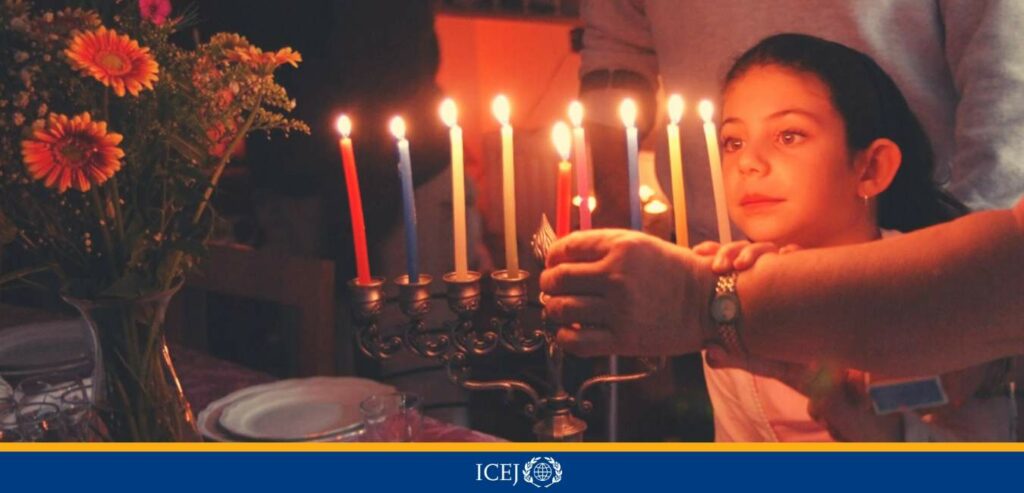 Israel Jewish Family celebrating Hanukkah Lighting Menorah