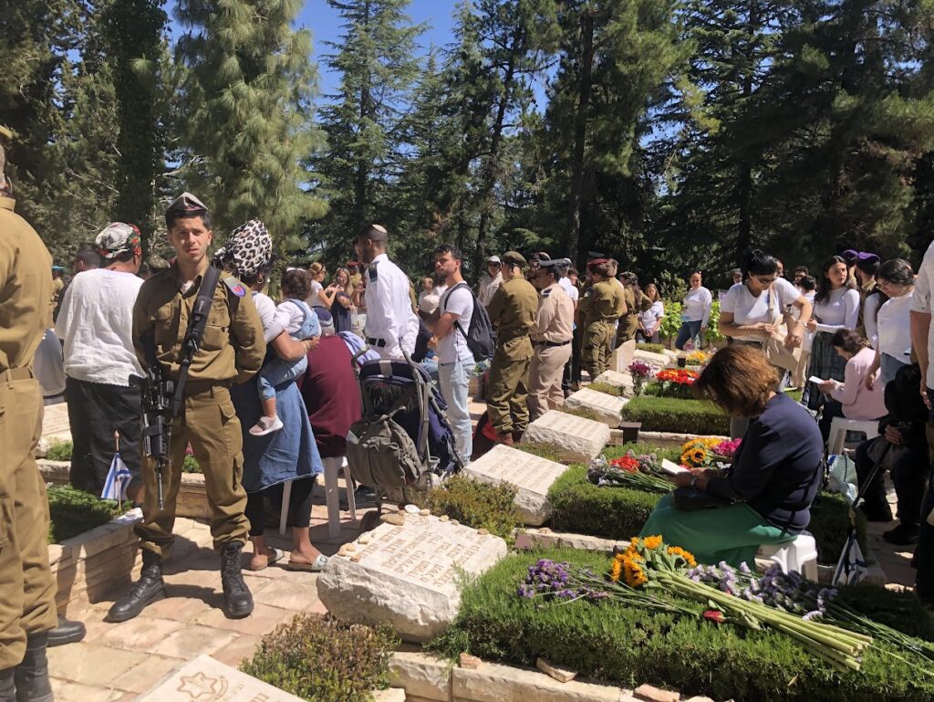 IDF soldier at grave of fallen soldier
