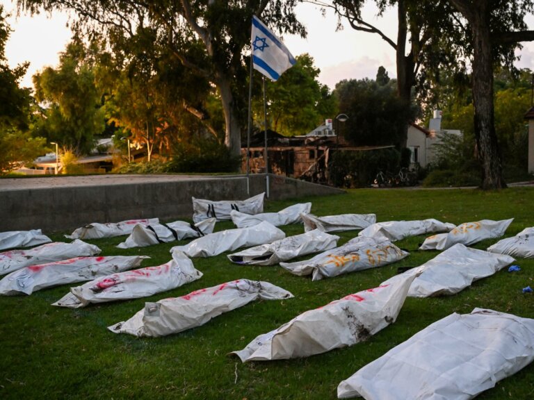 Many body bags lying on the ground in Israel