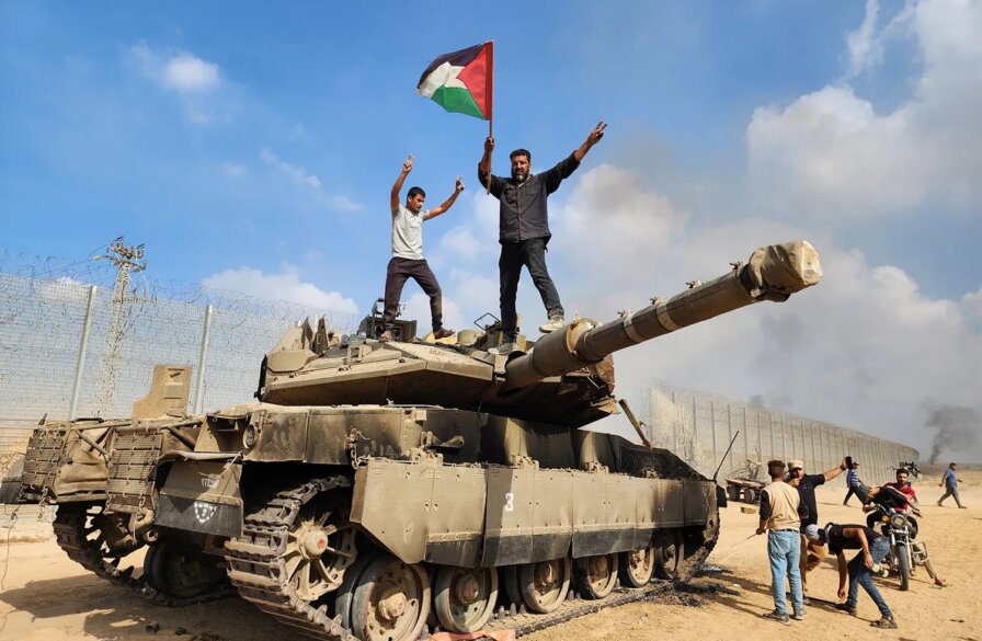 Hamas militia capture IDF tank and wave the Palestine flag