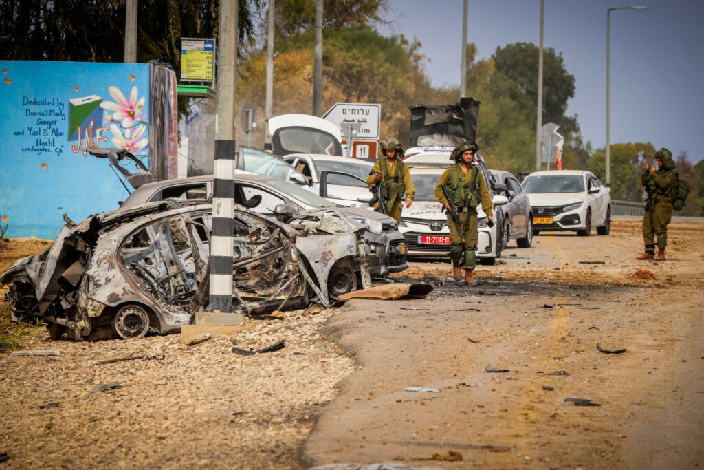 aid medical kits cars piled up at entrance to kibbutz alumim