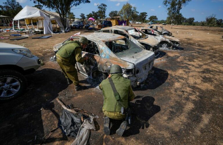 idf-troops-inspect-burned-out-cars-at-the-nova-music-festival