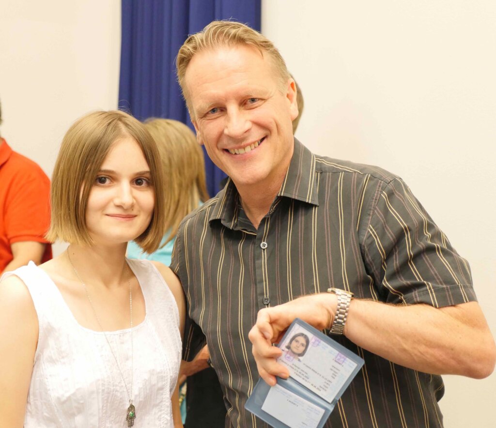 Ukrainian SELA graduate celebrates her new Israeli ID with an ICEJ leader.