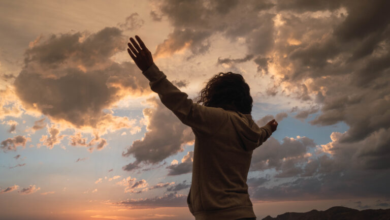 man with hands to heaven asking god to search his heart