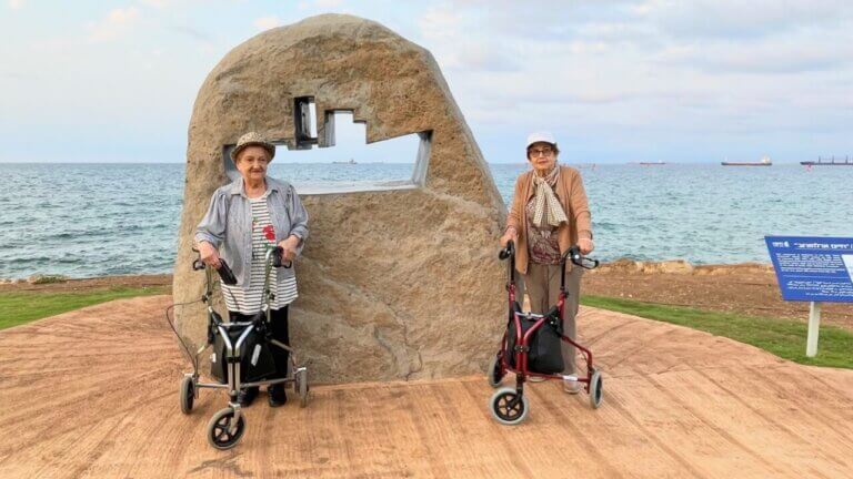 Survivors visit the ship memorial