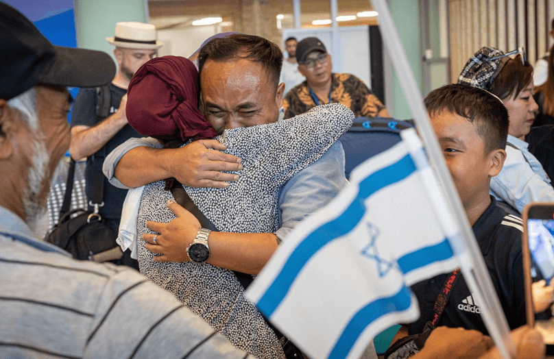 Ahron Hanghal embraces his mother Dina upon seeing her for the first time