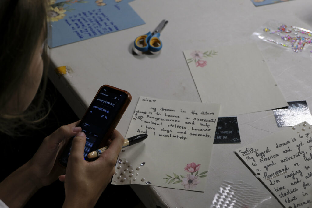 Youth write down their dreams for the future.