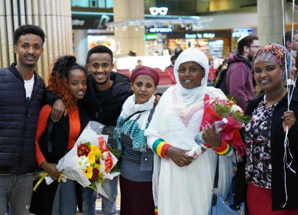Picture of happy people being welcomed