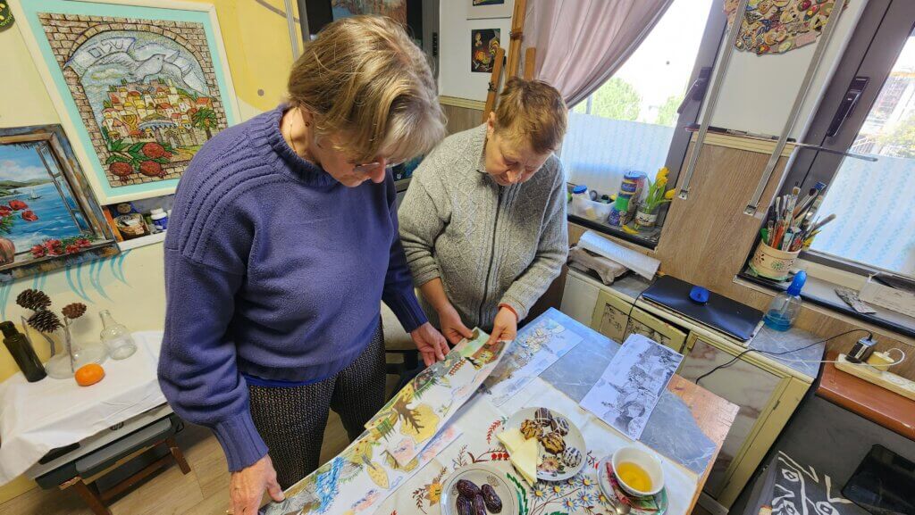 Tatiana shows her art to Corrie.
