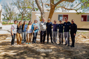 ICEJ-USA donors stand in front of the classroom they donated