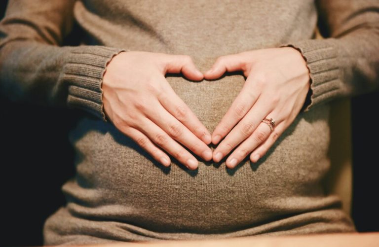 Mothers say yes to life banner image - mother with heart hands