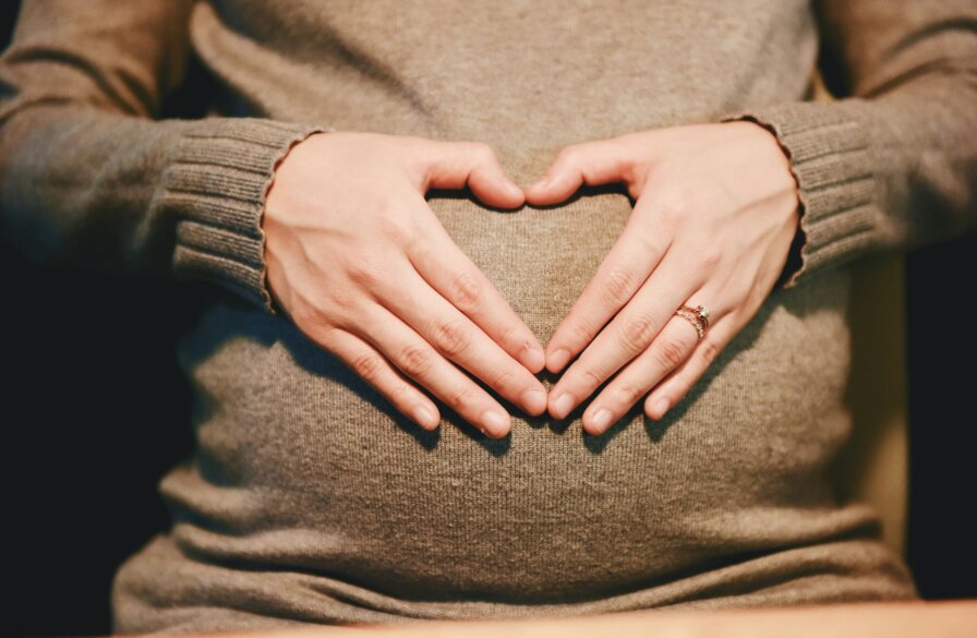 Mothers say yes to life banner image - mother with heart hands